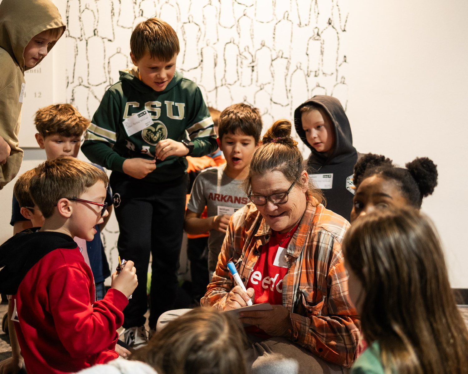 A kids ministry volunteer with a group of children